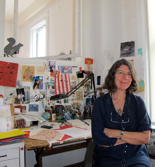 Jessie Hartland at her desk.